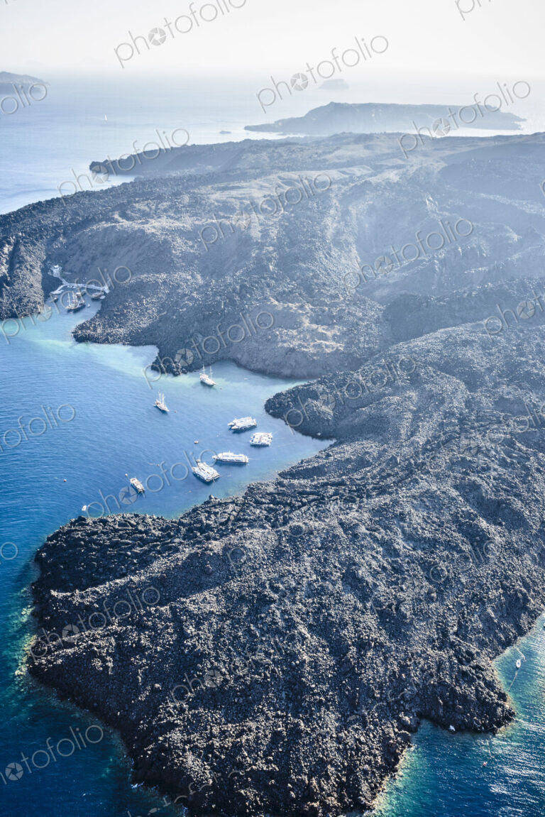 Aerial view of the landscape of an island in the caldera, volcanic rock and steep…