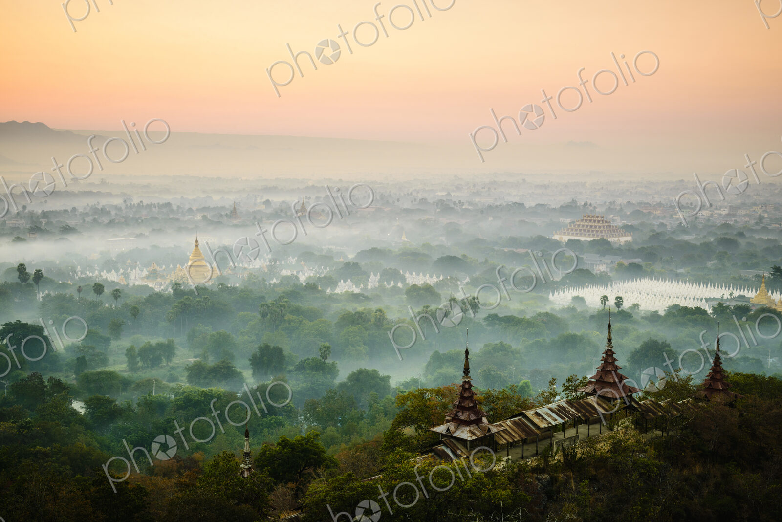 Aerial view of towers in misty landscape