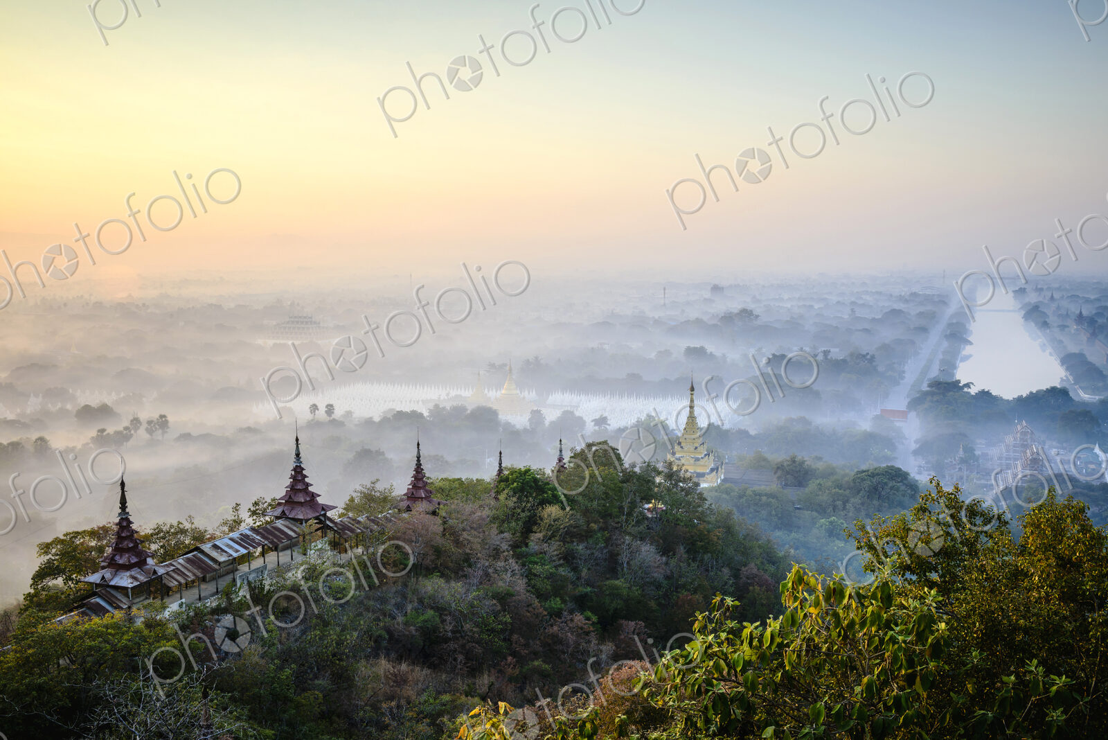 Aerial view of towers in misty landscape