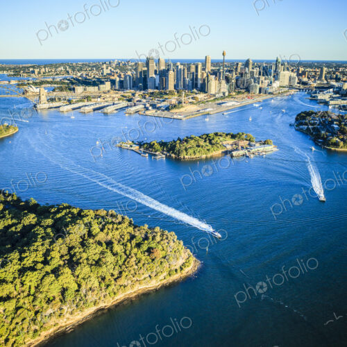 Aerial view over the city of Sydney, the water channels and the coastline of islands…