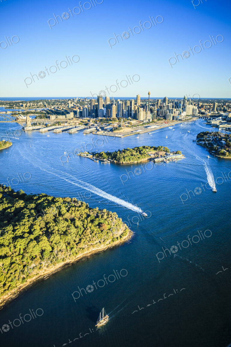 Aerial view over the city of Sydney, the water channels and the coastline of islands…