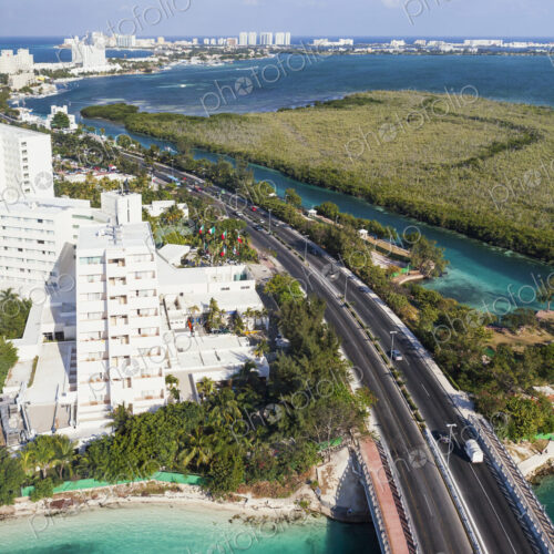 Aerial view over the hotel zone at Cancun, highway and high rise buildings, coastline. Aerial view over the hotel zone at Cancun, highway and high rise buildings, coastline.