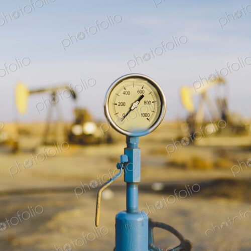 Air pressure gauge, oil rigs in background, Sunset-Midway oil fields, the largest in…
