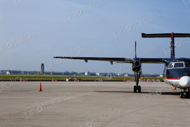 Aircraft on the airport tarmac, parked airside.