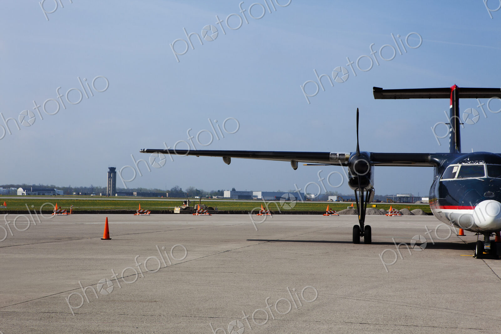 Aircraft on the airport tarmac, parked airside.