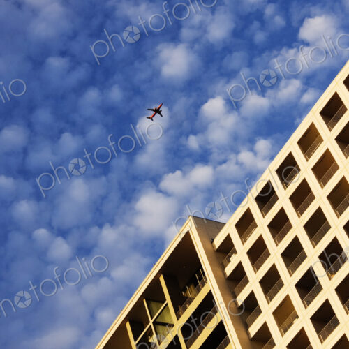 Airplane Flying Over Building Airplane Flying Over Building
