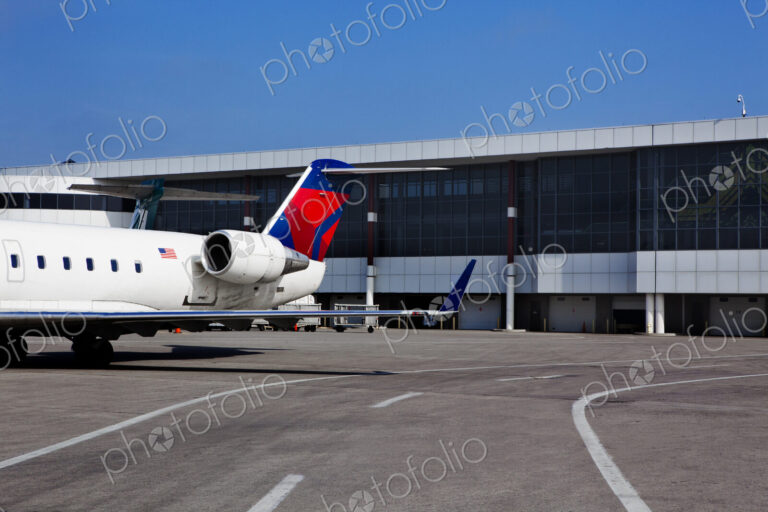 Airport buildings and a passenger aircraft on the ground