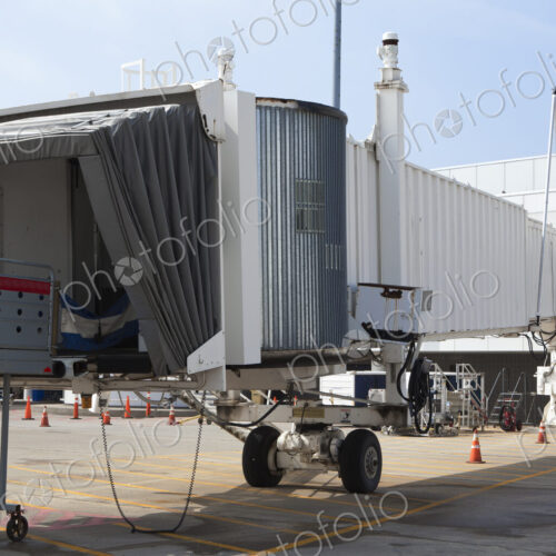 Airport equipment, airbridge, passenger boarding bridge and steps airside. Airport equipment, airbridge, passenger boarding bridge and steps airside.