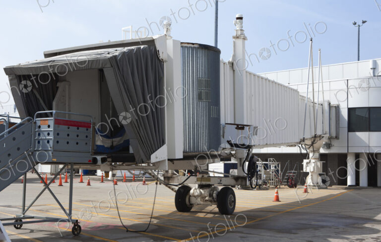 Airport equipment, airbridge, passenger boarding bridge and steps airside.