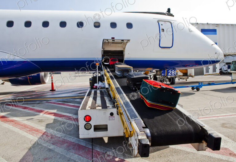 Airport, passenger aircraft on the ground, baggage being loaded