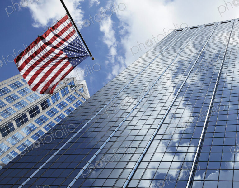 American Flag Against Office Buildings