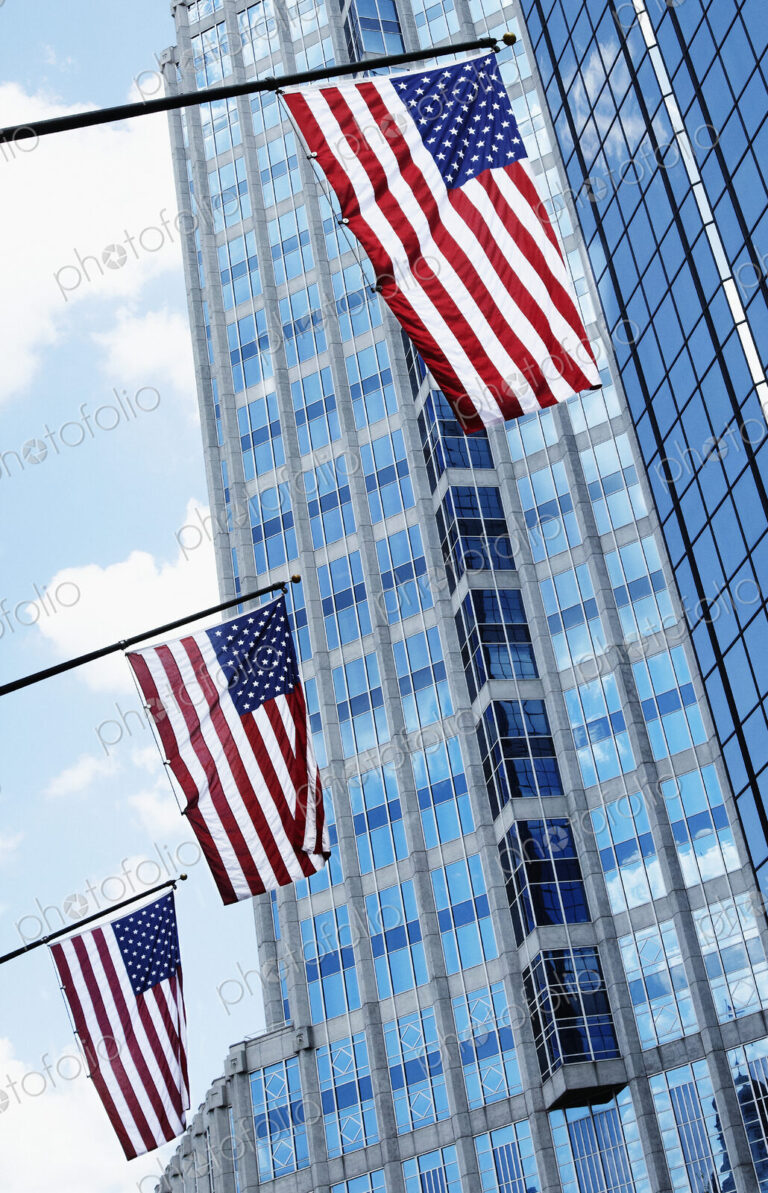 American Flags Against Office Buildings