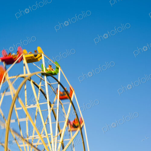 Amusement Park, Santa Cruz, a large ferris wheel,, low angle view, blue sky background.