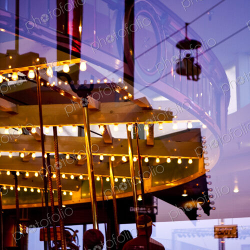 Amusement Park, Santa Cruz, reflectio of a roundabout ride in a funfair at dusk,…