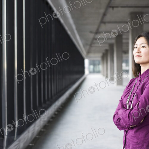An Asian female business owner in a new raw business space. An Asian female business owner in a new raw business space.
