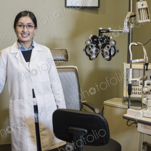 An Asian woman ophthalmologist in her office examination room. An Asian woman ophthalmologist in her office examination room.