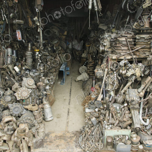 An Auto Parts store. A small workshop heaped up with spare car parts