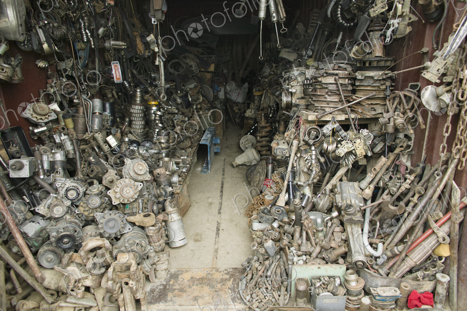 An Auto Parts store. A small workshop heaped up with spare car parts