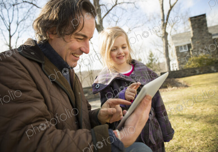 An Organic Farm in Winter in Cold Spring, New York State. A man holding a digital…