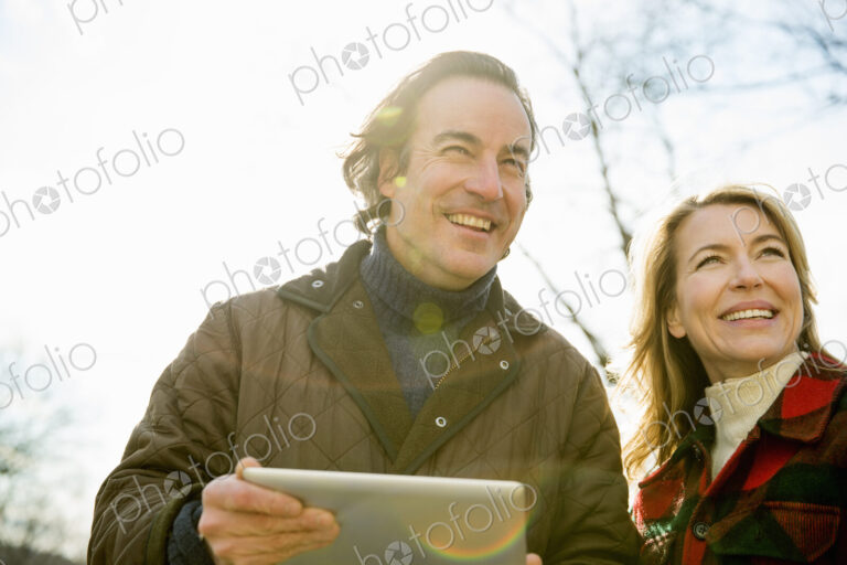 An Organic Farm in Winter in Cold Spring, New York State. A man holding a digital…