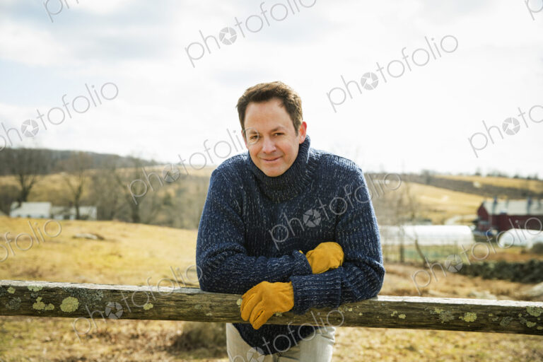 An Organic Farm in Winter in Cold Spring, New York State. A man working outdoors on…