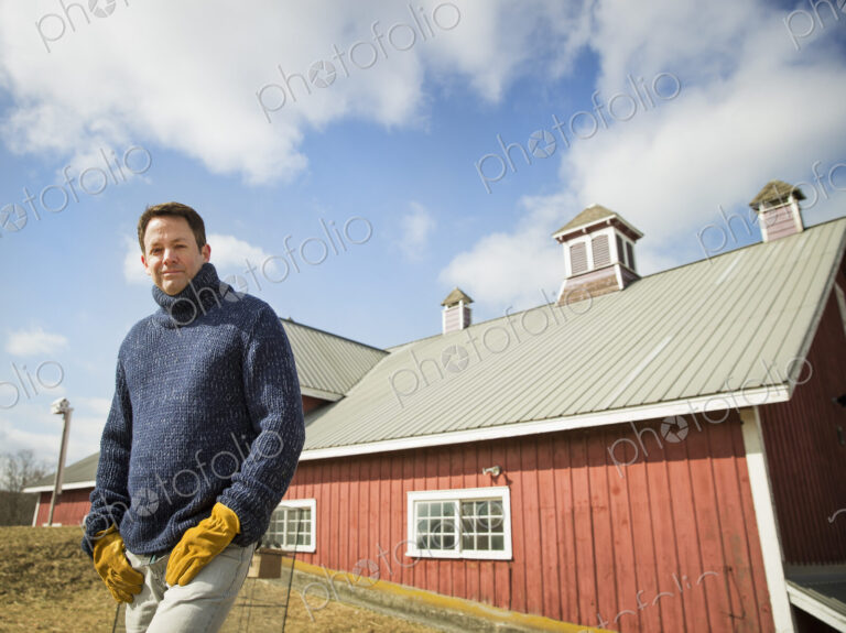 An Organic Farm in Winter in Cold Spring, New York State. A man working outdoors on…