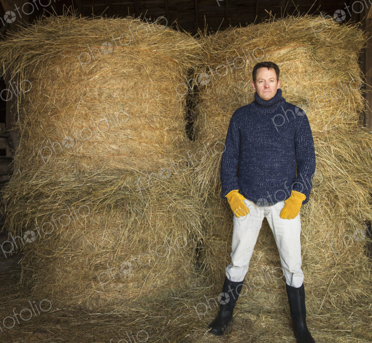 An Organic Farm in Winter in Cold Spring, New York State. A man working outdoors on…