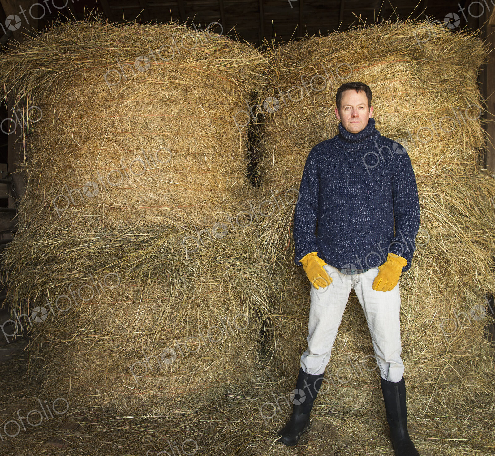 An Organic Farm in Winter in Cold Spring, New York State. A man working outdoors on…