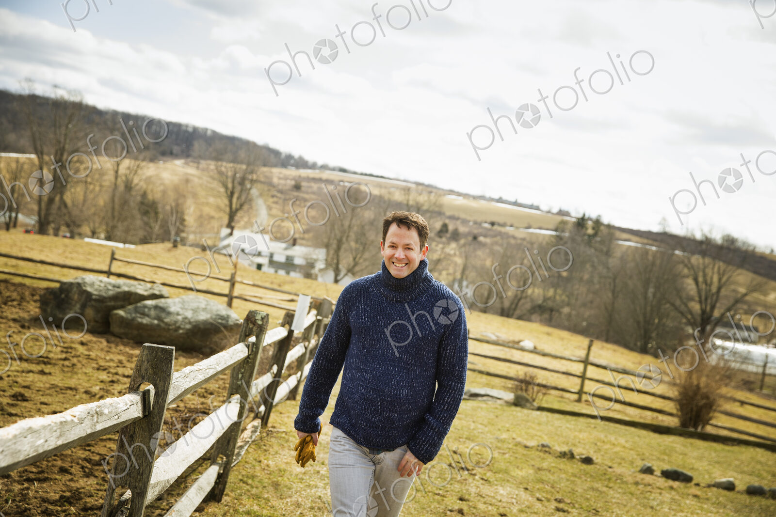 An Organic Farm in Winter in Cold Spring, New York State. A man working outdoors on…