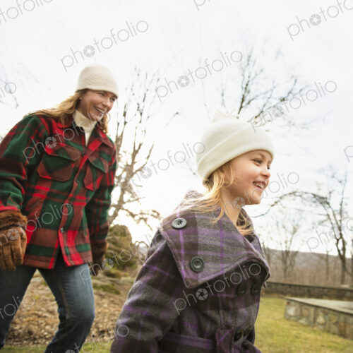 An Organic Farm in Winter in Cold Spring, New York State. A woman and child wrapped up… An Organic Farm in Winter in Cold Spring, New York State. A woman and child wrapped up…