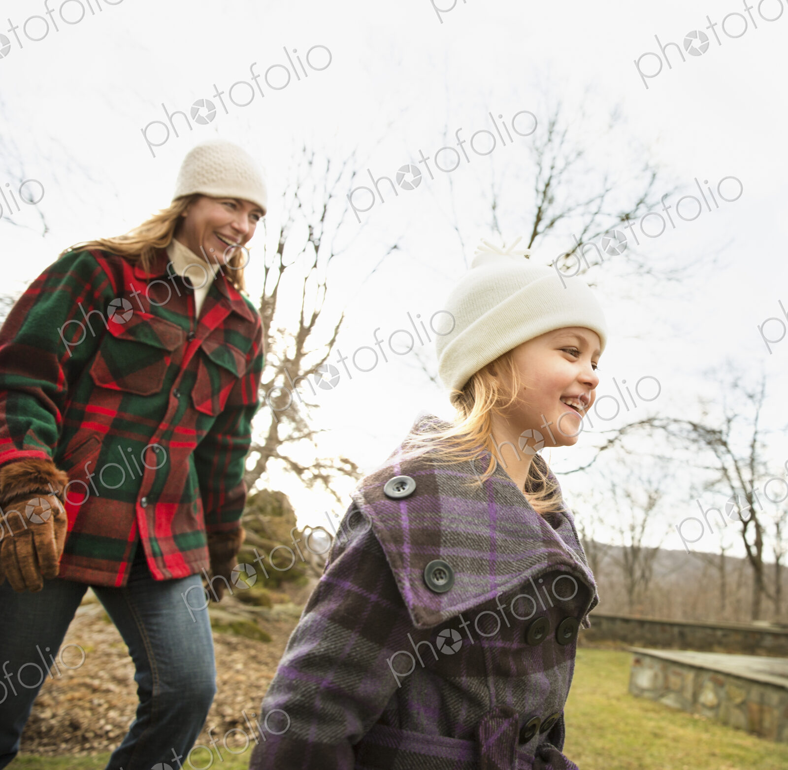 An Organic Farm in Winter in Cold Spring, New York State. A woman and child wrapped up…