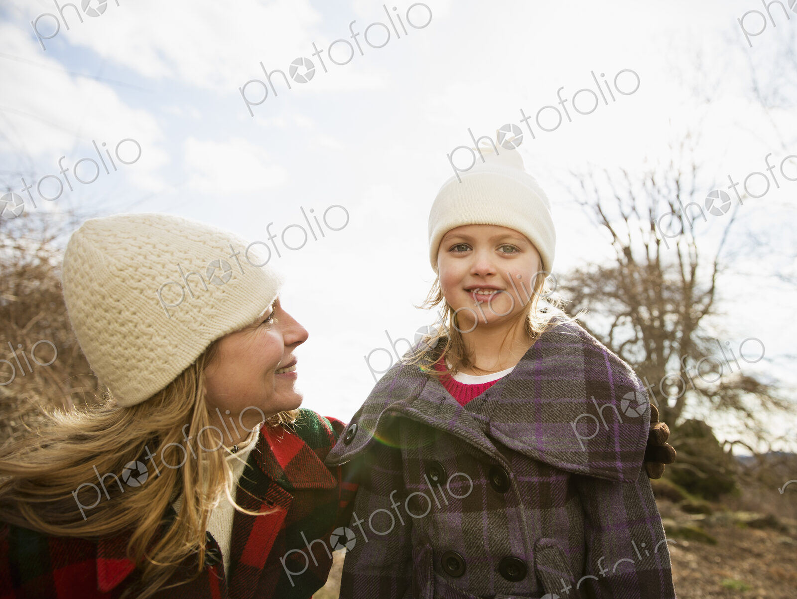 An Organic Farm in Winter in Cold Spring, New York State. A woman and child wrapped up…