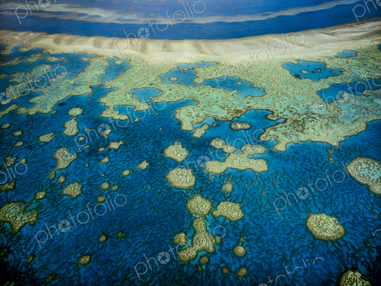 An aerial view of the islands of the Great Barrier Reef in Queensland, Australia