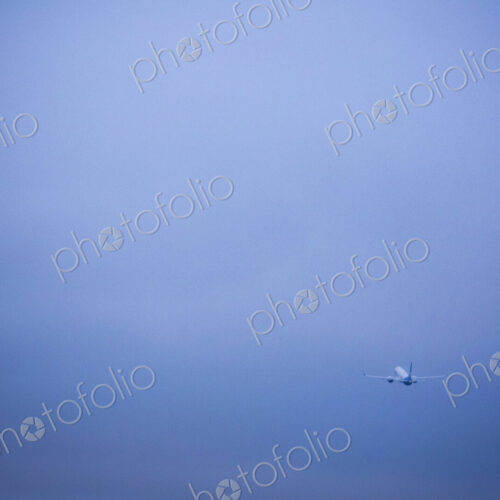 An aircraft taking off in a clear blue sky. An aircraft taking off in a clear blue sky.