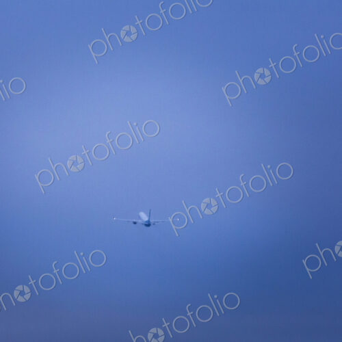 An aircraft taking off in a clear blue sky. An aircraft taking off in a clear blue sky.