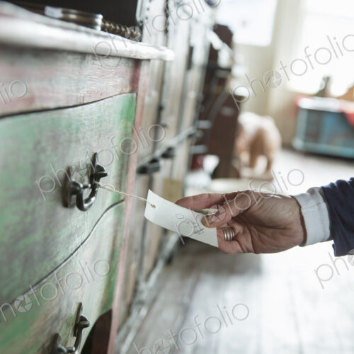 An antique store in a small town, with objects and furniture from the past. A woman's… An antique store in a small town, with objects and furniture from the past. A woman's…