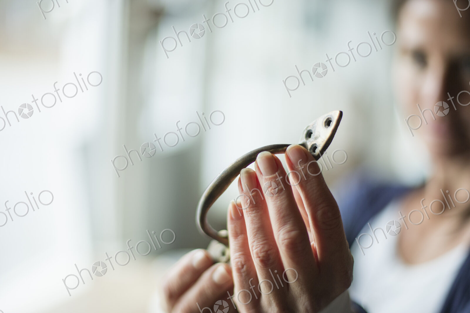 An antique store in a small town, with objects and furniture from the past. A woman…