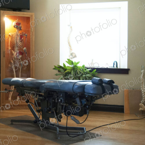 An assisted living and care home for seniors, modern building, a treatment couch and…