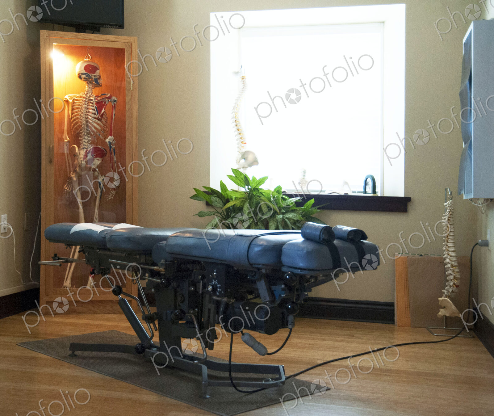 An assisted living and care home for seniors, modern building, a treatment couch and…