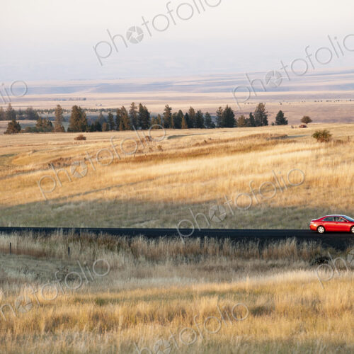 An automobile on the road in eastern Washington State, USA An automobile on the road in eastern Washington State, USA