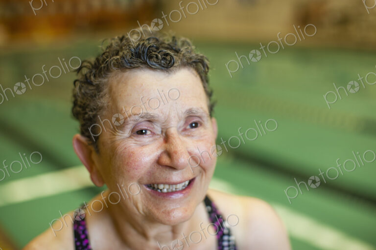 An elderly woman in a swimming pool.