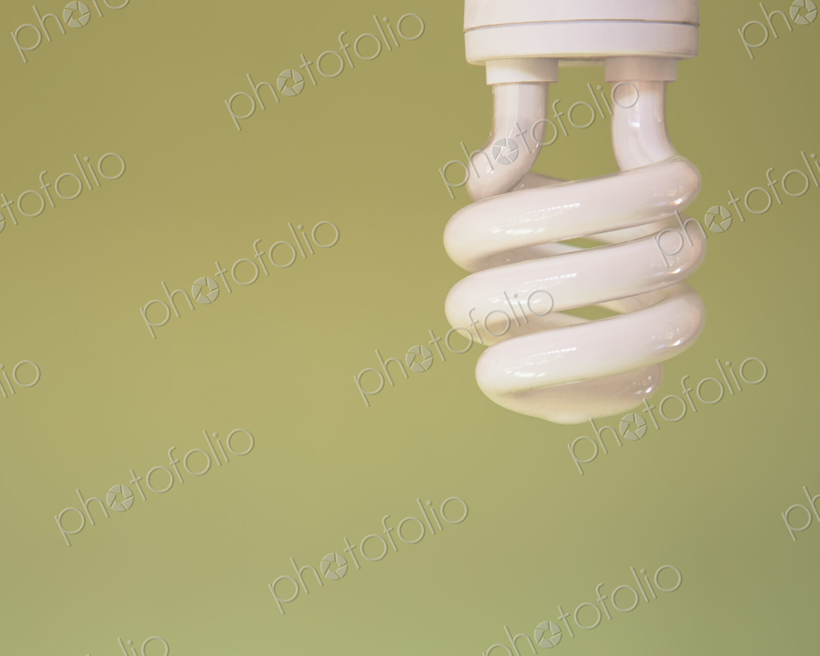 ~An energy efficient compact fluorescent light bulb, a CFL, with a curled element. A…