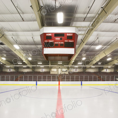 An indoor ice hockey arena, with an overhead electronic score board in Bonnyville, Canada.