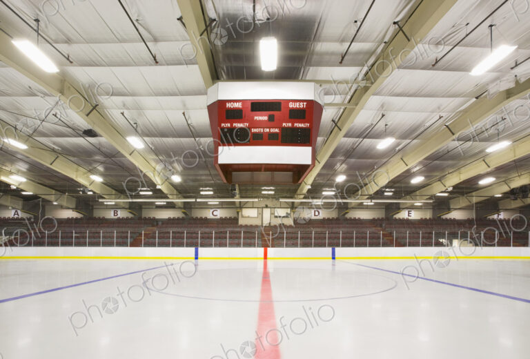 An indoor ice hockey arena, with an overhead electronic score board in Bonnyville, Canada.