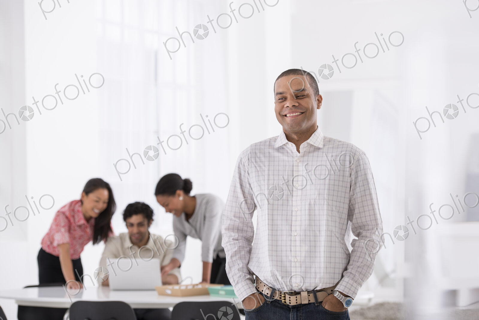 An office in the city. Business. A man standing with his hands in his pockets, and…