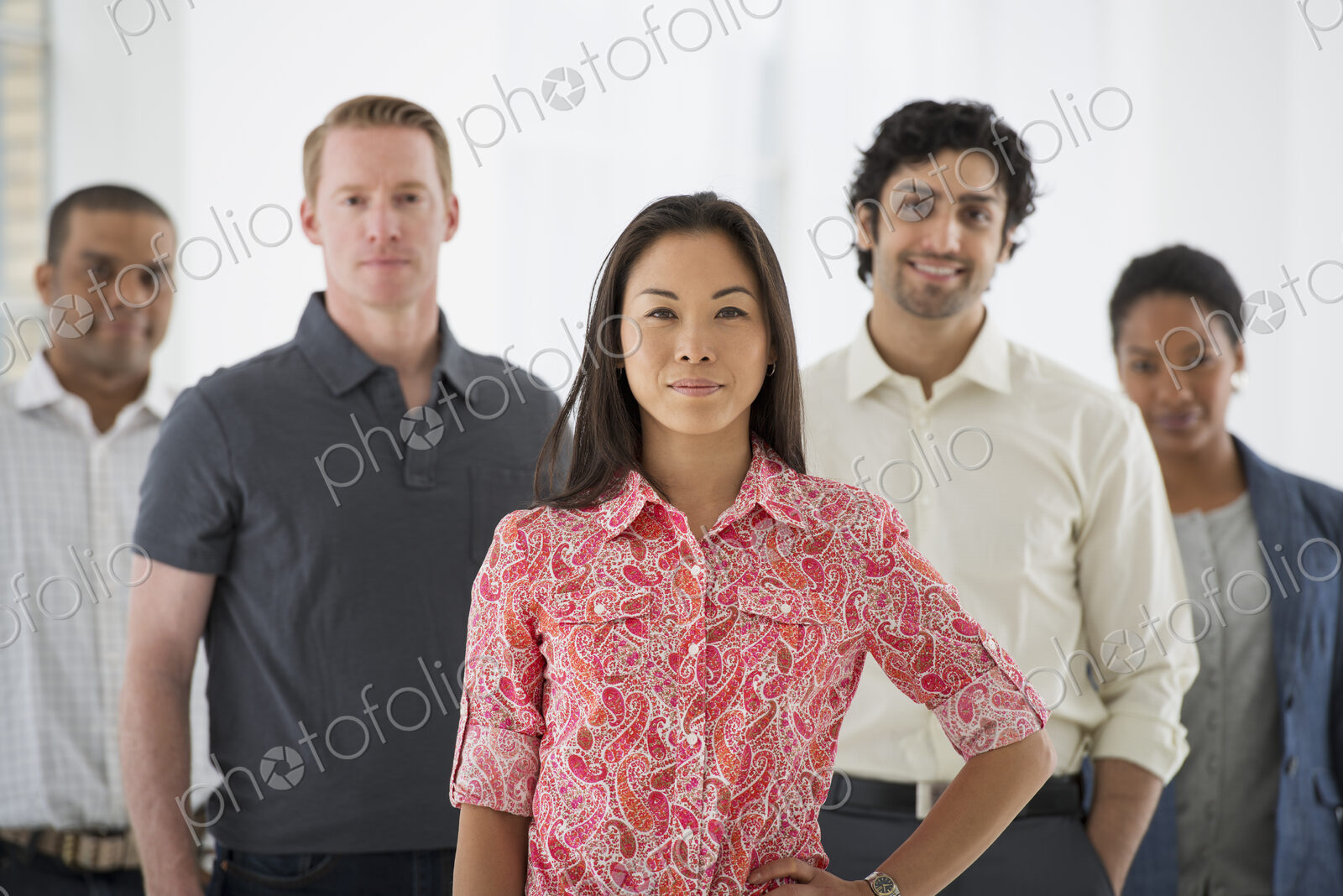 An office in the city. Business. A team of people, a multi ethnic group, men and women…