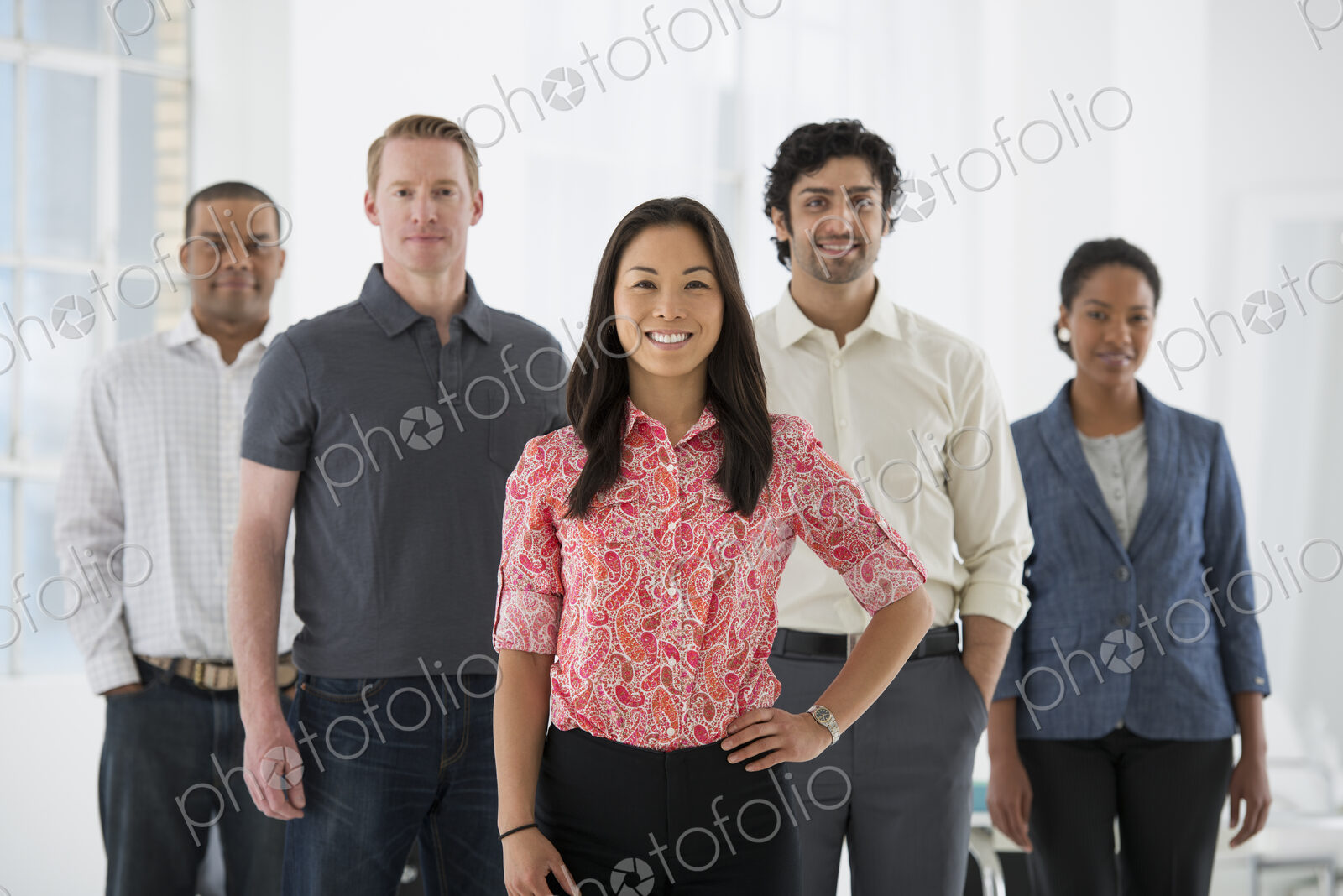 An office in the city. Business. A team of people, a multi ethnic group, men and women…