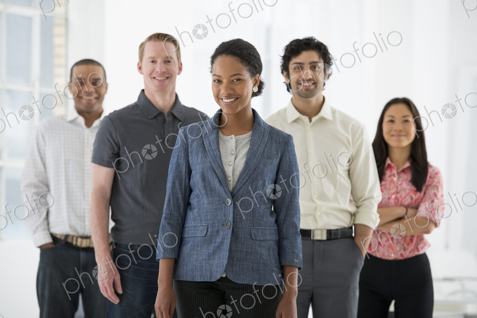 An office in the city. Business. A team of people, a multi ethnic group, men and women…