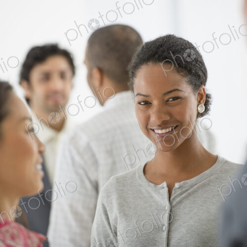 An office in the city. Business. A team of people, a multi ethnic group, men and women…