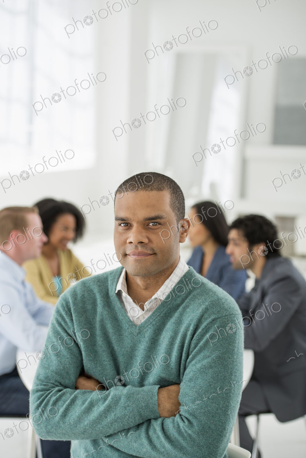 An office in the city. Business. Team meetings. A group sitting down around a table.…